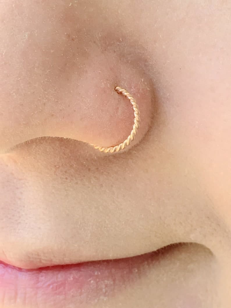 Golden nose pin twisted