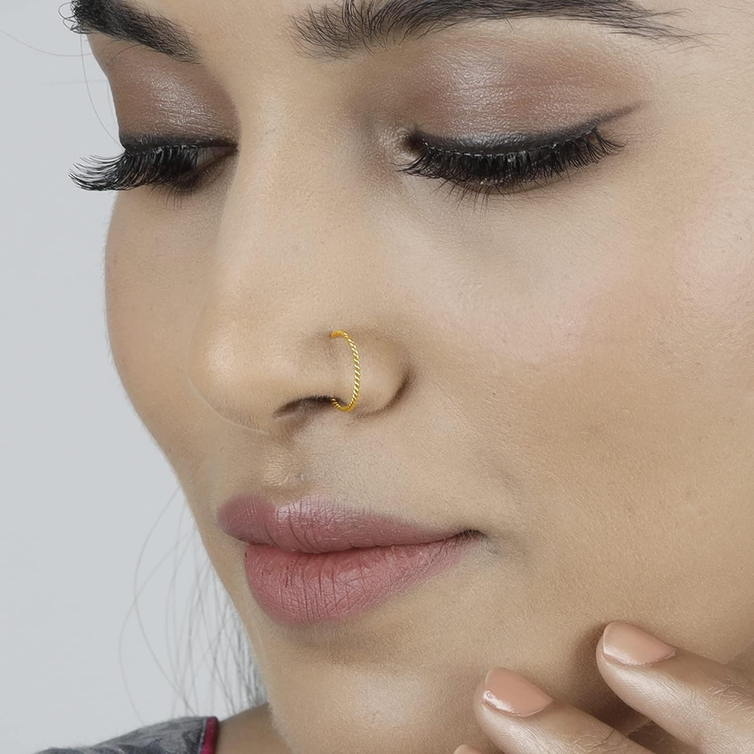 Golden nose pin twisted